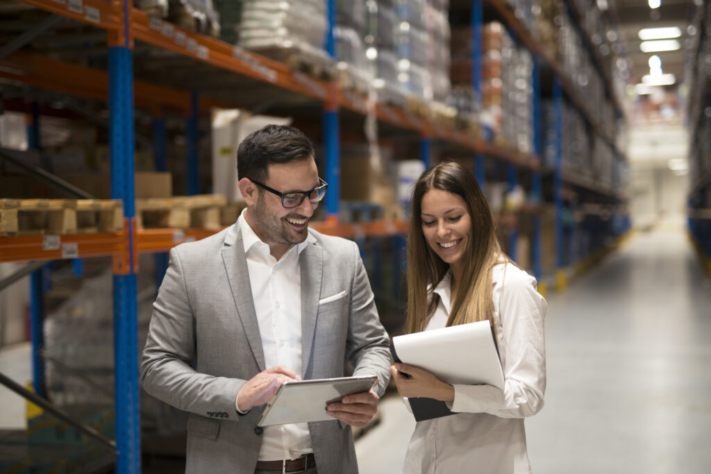 Fulfillment Warehouse Manager Working with a Small Business Owner.