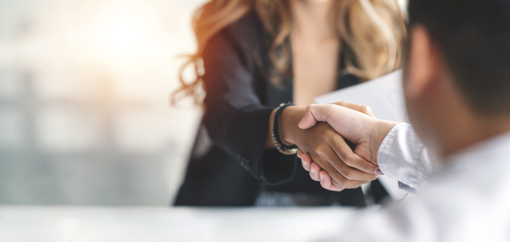 Ecommerce Business Owner and Fulfillment Warehouse Provider Shaking Hands.