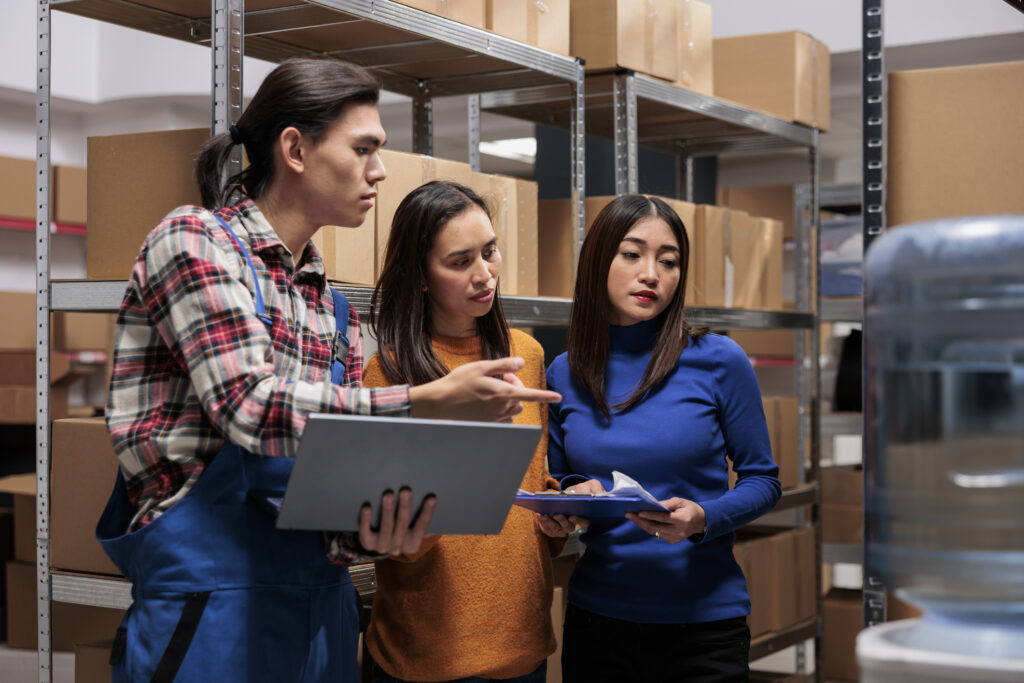 Warehouse Fulfillment Company Workers Planning for the Day.