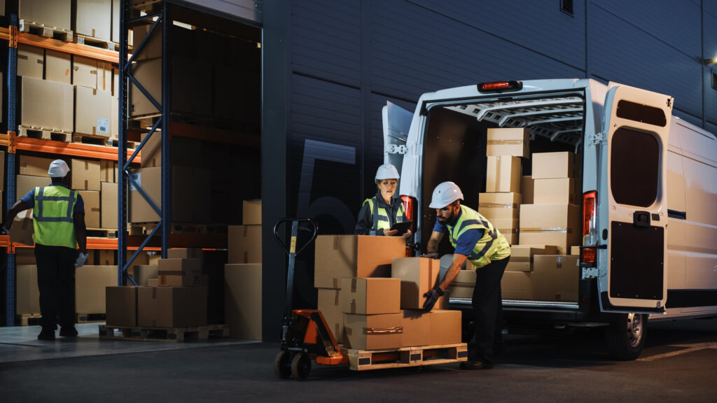 eCommerce Fulfillment Warehouse Workers Packing the Delivery Truck.