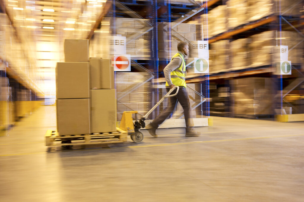 Fulfillment Worker Getting Packages together for the Holiday Season of Black Friday and Cyber Monday