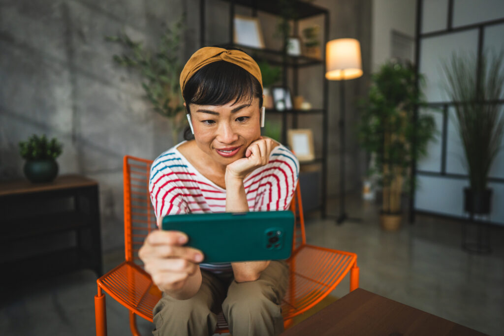 Woman watching TikTok videos and then shopping.